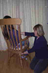 Carolyn Potter giving seated reiki treatment